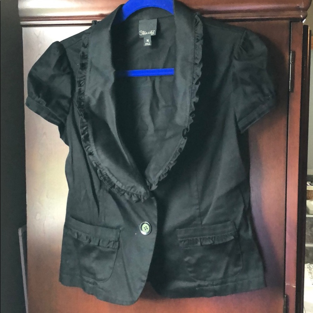 Short sleeved black jacket with ruffles